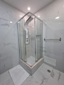 a shower with a glass door in a bathroom at Vale do Sol in Albufeira +10 photos