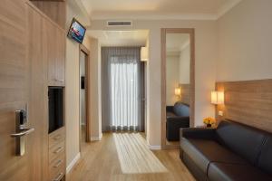 Телевизор и/или развлекательный центр в Hotel Rossini
