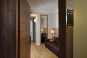 Кровать или кровати в номере Hotel Rossini