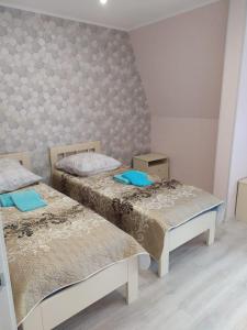 Cama o camas de una habitación en Guest House Na Lesnoy
