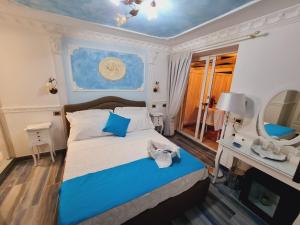Postel nebo postele na pokoji v ubytování luxury B&B e FAMILY RESIDENCE VILLA FILOMENA