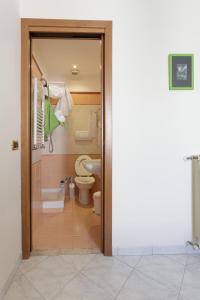 a bathroom with a toilet and a sink at NiceToMeetYou in Rome