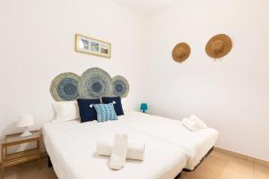 A bed or beds in a room at Stay U-nique Apartments Mistral Még 9 kép
