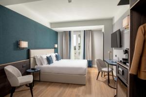 Postel nebo postele na pokoji v ubytování Hotel St Martin by OMNIA hotels