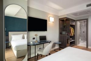 Postel nebo postele na pokoji v ubytování Hotel St Martin by OMNIA hotels