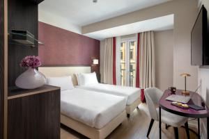 Postel nebo postele na pokoji v ubytování Hotel St Martin by OMNIA hotels