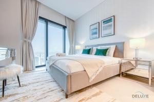 Postel nebo postele na pokoji v ubytování Captivating 1BR at The Address Residences in JBR by Deluxe Holiday Homes