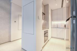 Kuchyň nebo kuchyňský kout v ubytování Captivating 1BR at The Address Residences in JBR by Deluxe Holiday Homes