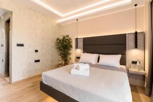 Postel nebo postele na pokoji v ubytování Megusta Suites