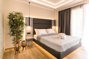 Postel nebo postele na pokoji v ubytování Megusta Suites