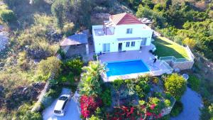 an aerial view of a house with a swimming pool at Villa Karin , with beautiful seaview! in Georgioupoli