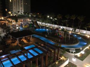 an overhead view of a swimming pool at night at SALINAS EXCLUSIVE RESORT in Salinópolis
