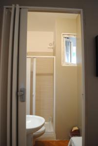 Koupelna v ubytování Dreaming Verona Rooms + 37 fotografií