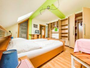 a bedroom with a large bed in a room at Vural Rooms in Gmünd
