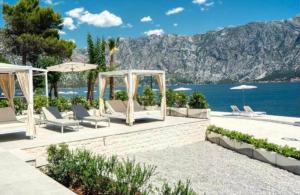 a wedding at the beach with chairs and umbrellas at AMAZING SEA VIEW Guest House ADRIATICA in Kotor