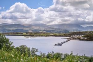 a large lake with a dock in the middle at Menai View in Llandegfan +4 photos