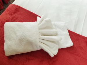 a pair of white gloves sitting on a red surface at Preston Hotel in Yeovil