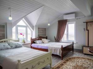 Postel nebo postele na pokoji v ubytování Conacul Mierii