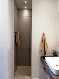 a bathroom with a shower and a sink at Villa Aetos in Paleros