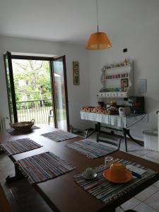 a living room with a table with dishes on it at B&B Carunei in Poggiridenti