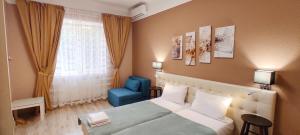 Кровать или кровати в номере Apart Club Dzhambula