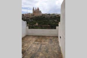 a balcony with a view of a city at Mellieha Luxury Penthouse with sea & country views in Mellieħa +2 photos