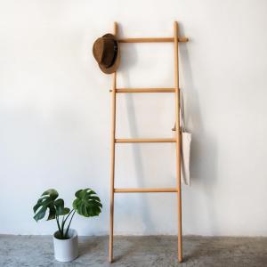 a wooden shelf leaning against a wall with a plant at Costa Azzurra Hotel in Skala Kefalonias