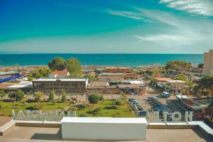 an aerial view of a town with the ocean at Hotel Margjokaj in Velipojë +39 photos