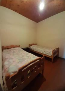 Postel nebo postele na pokoji v ubytování Guest House Malkhaz Niguriani