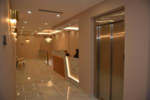 a lobby of a hotel with a reception desk at Hotel Margjokaj in Velipojë