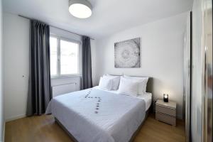 Posteľ alebo postele v izbe v ubytovaní On Time Apartment