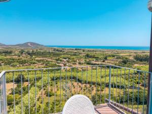 a balcony with a view of the ocean at BILOCALE CON VISTA MARE E TERRAZZA PANORAMICA Ammentos Posada in Posada +23 photos