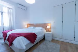 Postel nebo postele na pokoji v ubytování Lagoa Hostel & Suites