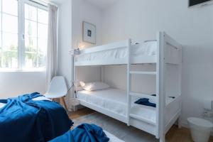 Postel nebo postele na pokoji v ubytování Lagoa Hostel & Suites