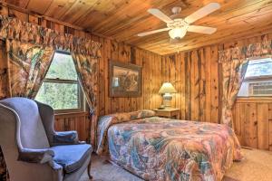 a bedroom with a bed and a ceiling fan at Idyllic Black Hills Getaway 3 Mi to Pactola Lake! in Rapid City