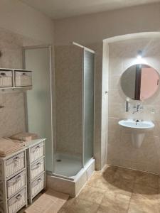 a bathroom with a shower and a sink at Country House & Restaurant Hronec in Hronec +20 photos