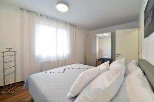 Posteľ alebo postele v izbe v ubytovaní On Time Apartment