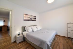 Posteľ alebo postele v izbe v ubytovaní On Time Apartment