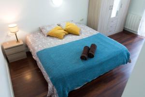 Posteľ alebo postele v izbe v ubytovaní La plaza apartment