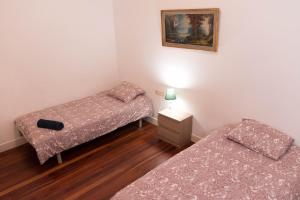 Posteľ alebo postele v izbe v ubytovaní La plaza apartment