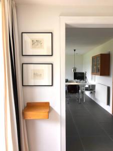 a room with a hallway with a table and a desk at Das Haus am Berg in Rathmannsdorf