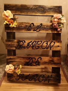 a wooden staircase with a sign that says welcome to our wedding at El Rincón de Pirón in Losana de Pirón