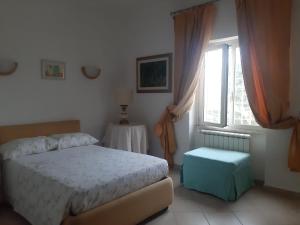 Säng eller sängar i ett rum på Villino dei Coralli