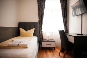 Ein Bett oder Betten in einem Zimmer der Unterkunft Wiesentäler Hof Hotel garni