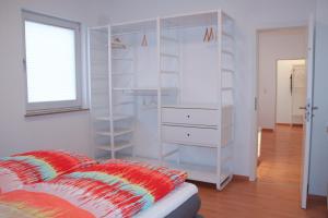 Säng eller sängar i ett rum på Premium Ferienwohnung Sonnenaufgang