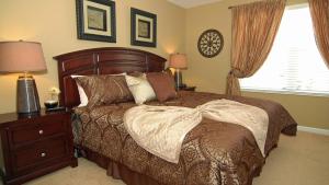 A bed or beds in a room at The Ultimate Villa on Windsor Hills Resort, Orlando Villa 4768