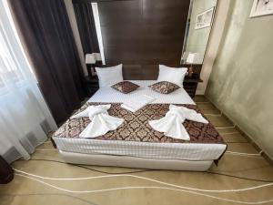 Postel nebo postele na pokoji v ubytování Hotel Nevada + 37 fotografií