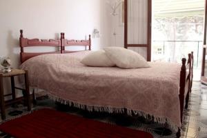 A bed or beds in a room at Il Gabbiano Piano Terra - Goelba