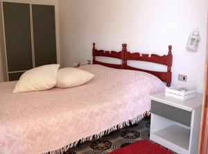 A bed or beds in a room at Il Gabbiano Piano Terra - Goelba