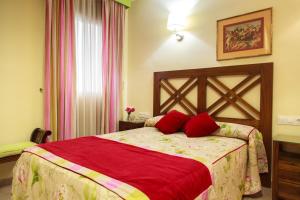Кровать или кровати в номере Hostal Antigua Morellana